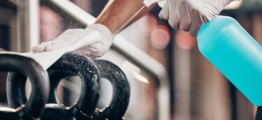 cleaning a kettle bell in the gym