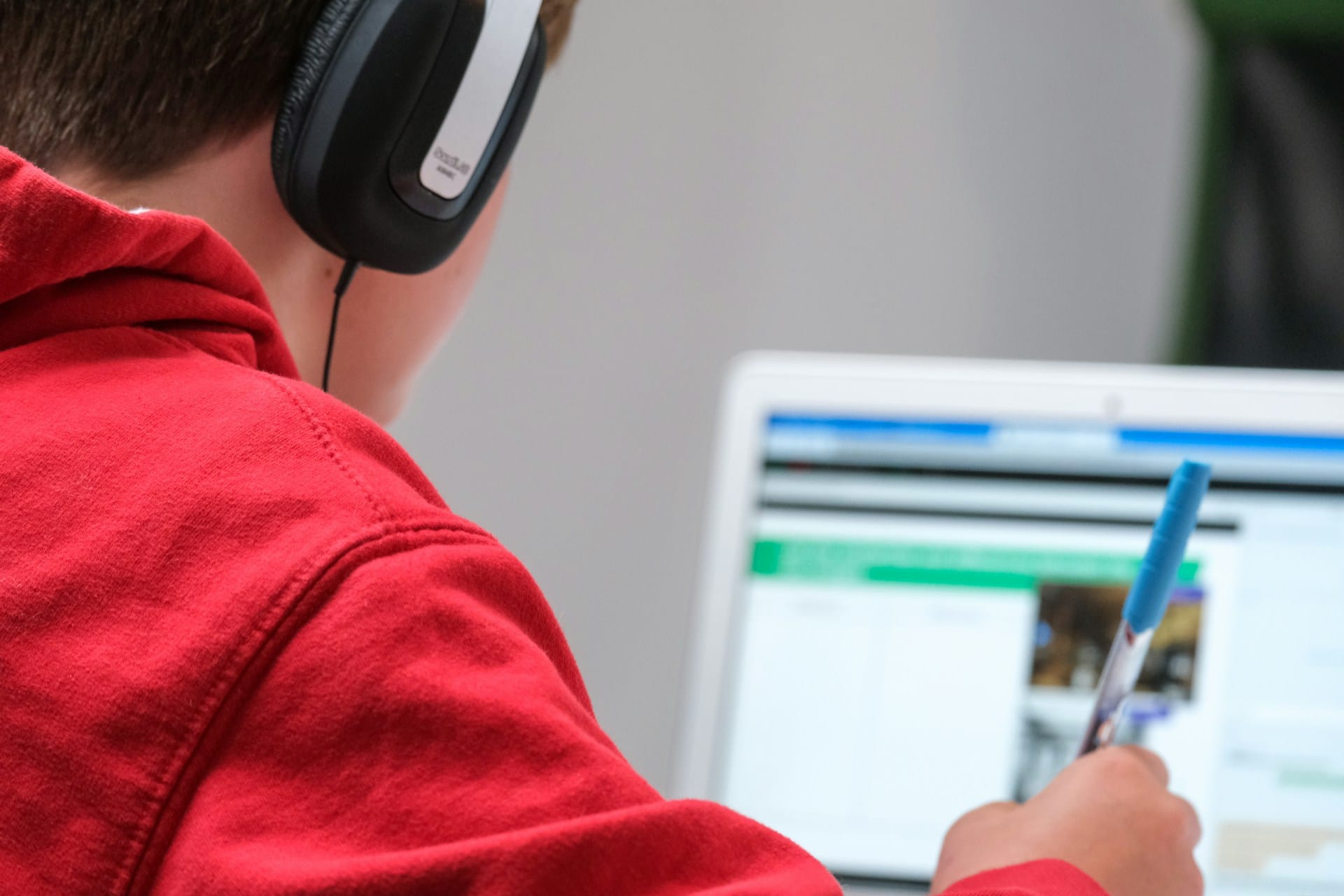child using school laptop to learn