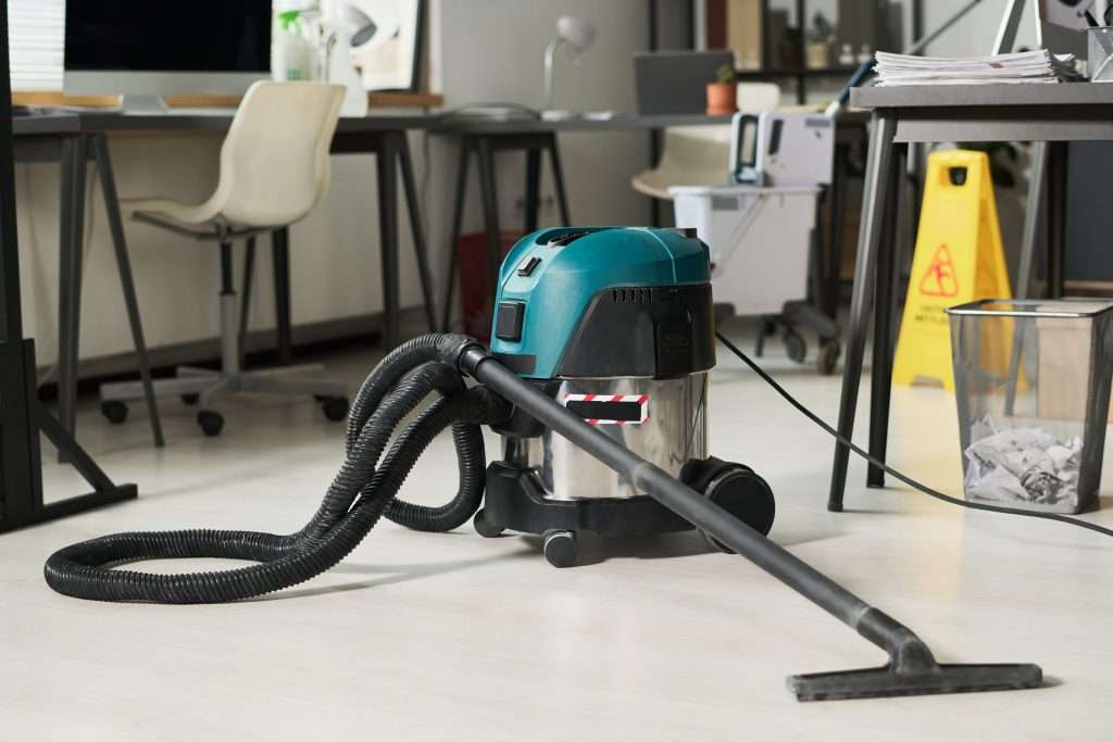 Hoover on floor of the office ready to be used