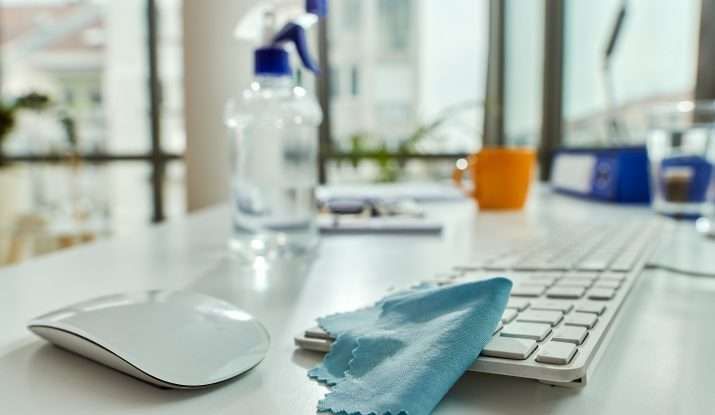 disinfectant spray bottle on the office desk
